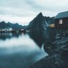Eliassens-roburer-night-water-reflections-red-cabins-lofoten-norway